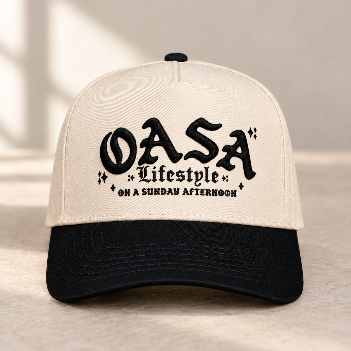 OASA Lifestyle embroidered natural and black hat mockup in soft natural light